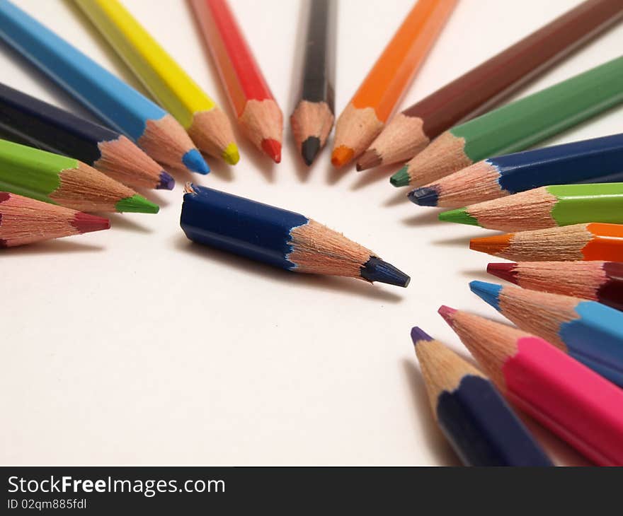 Close up of color pencils with different color over white background. Close up of color pencils with different color over white background.