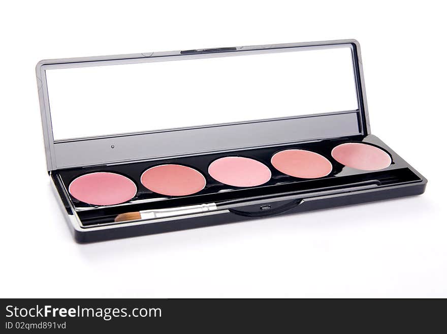 Colorful lipstick in a box with a mirror and a brush inside on white background. Colorful lipstick in a box with a mirror and a brush inside on white background