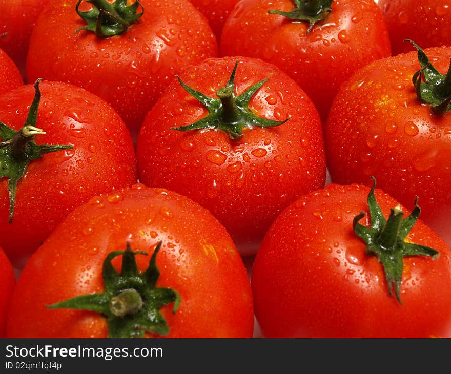 Organically grown red cherry tomatoes background. Organically grown red cherry tomatoes background