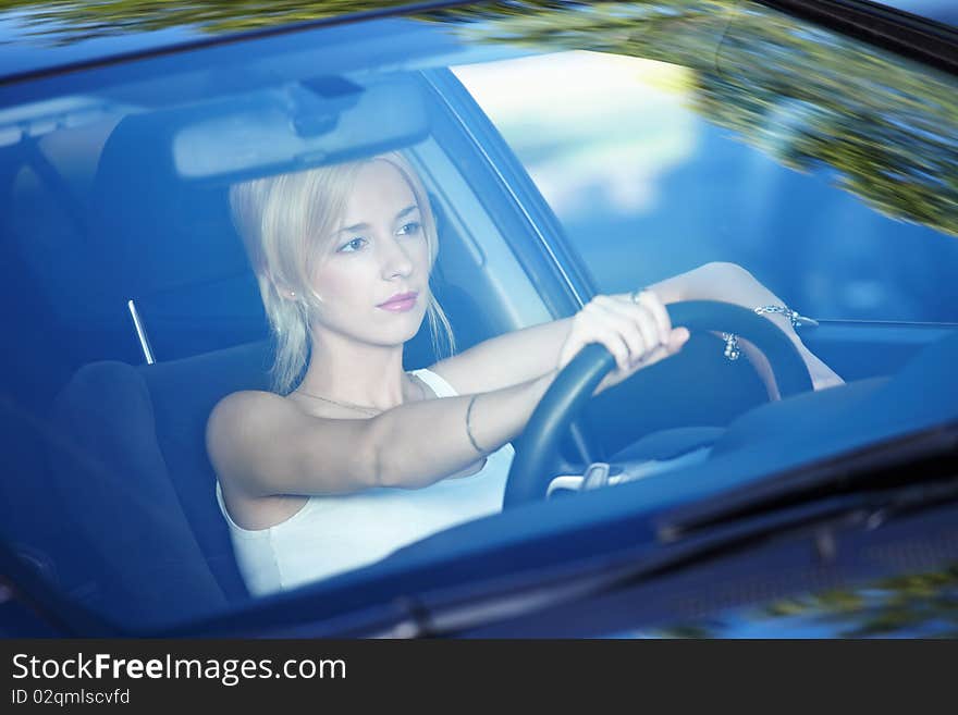 Young attractive girl behind the wheel. Young attractive girl behind the wheel