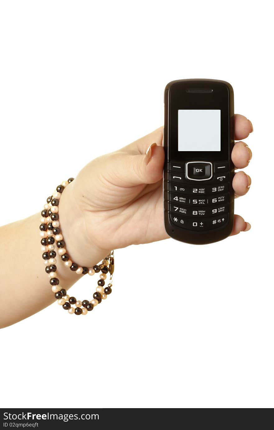 Mobile phone in the women's hand isolated on white background