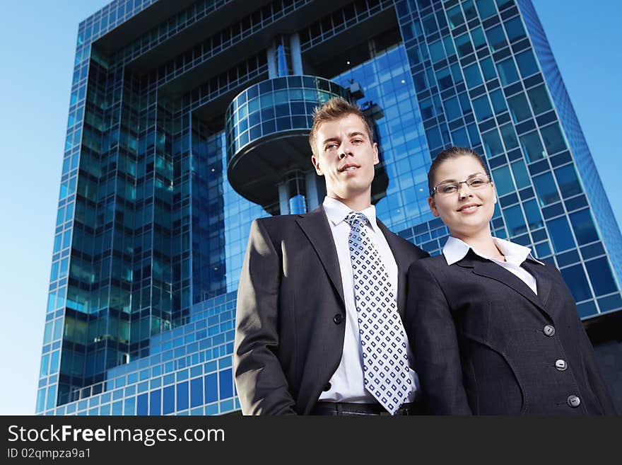 Business people on the background of the business buildings. Business people on the background of the business buildings