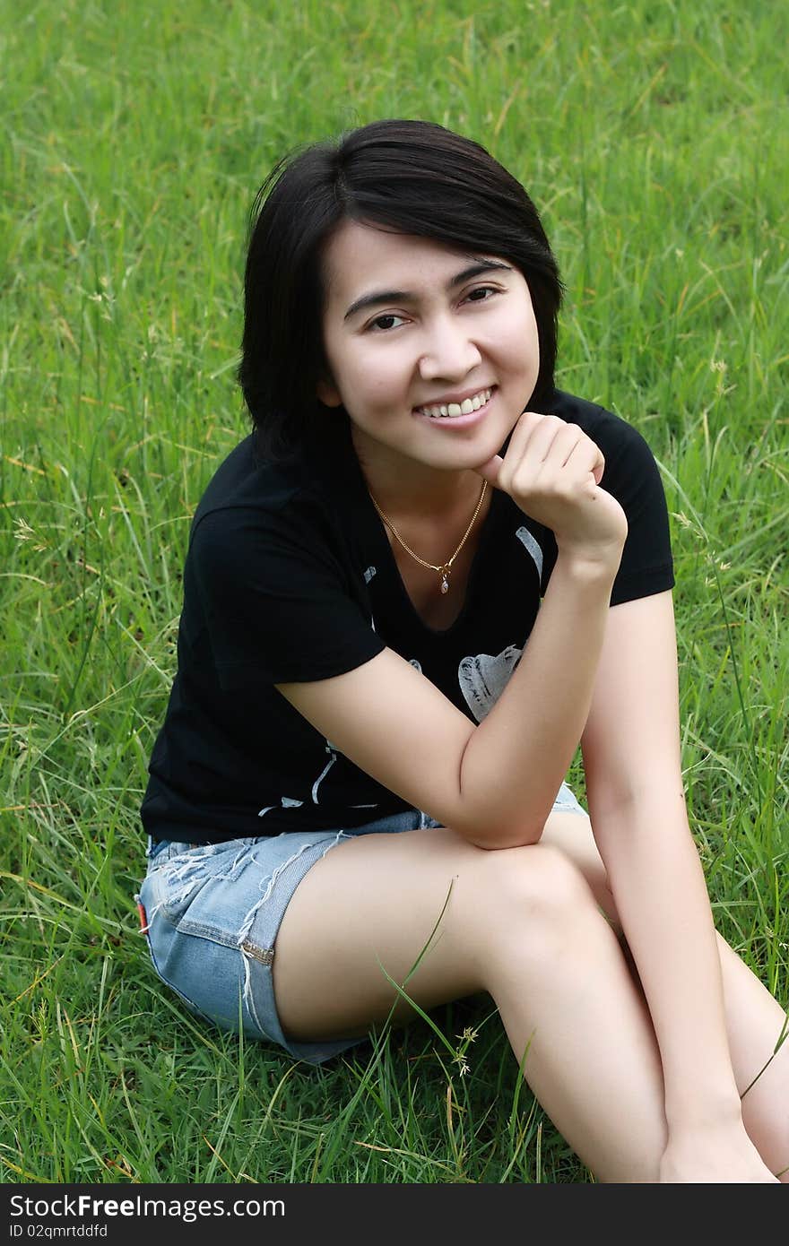 Portrait of a beautiful Asian woman at the park. Portrait of a beautiful Asian woman at the park.