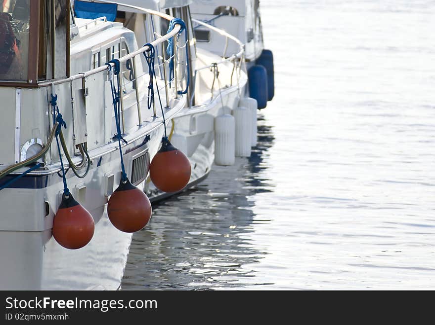 Side shot of boats being stationed in a marina