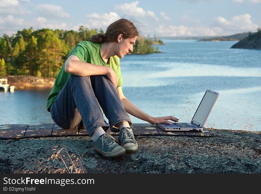 The young man resting on the lake. The young man resting on the lake.