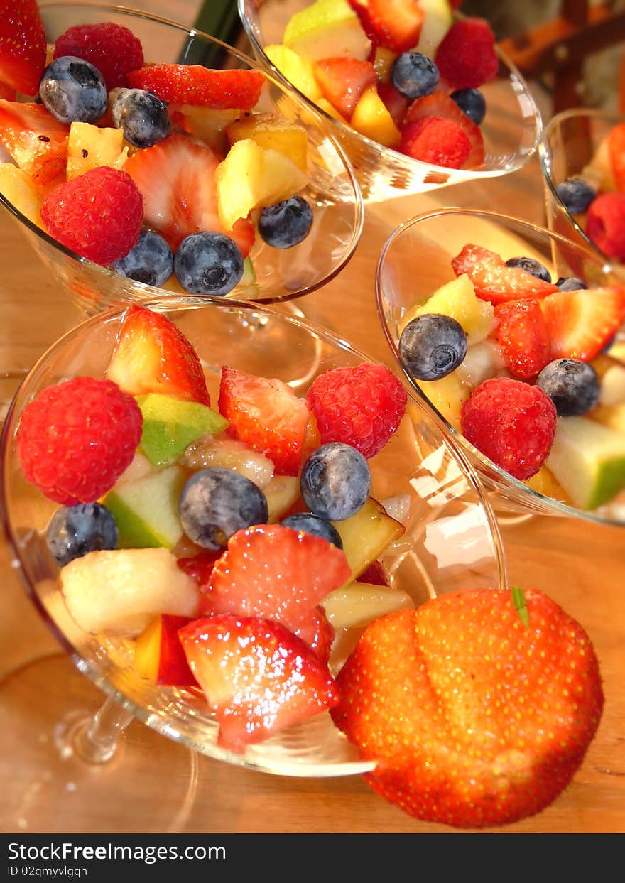 Multicolored fresh summer fruit-dessert closeup. Multicolored fresh summer fruit-dessert closeup