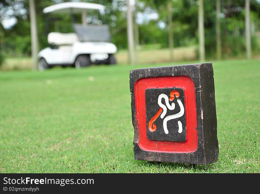 THe Golf sign and the Cart