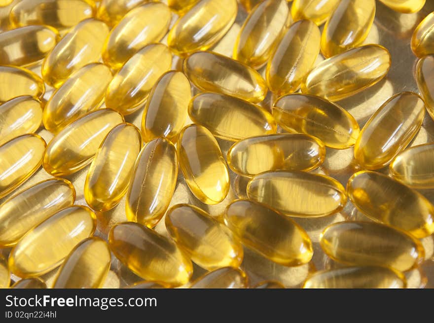 Yellow fish oil vitamines close up. Yellow fish oil vitamines close up