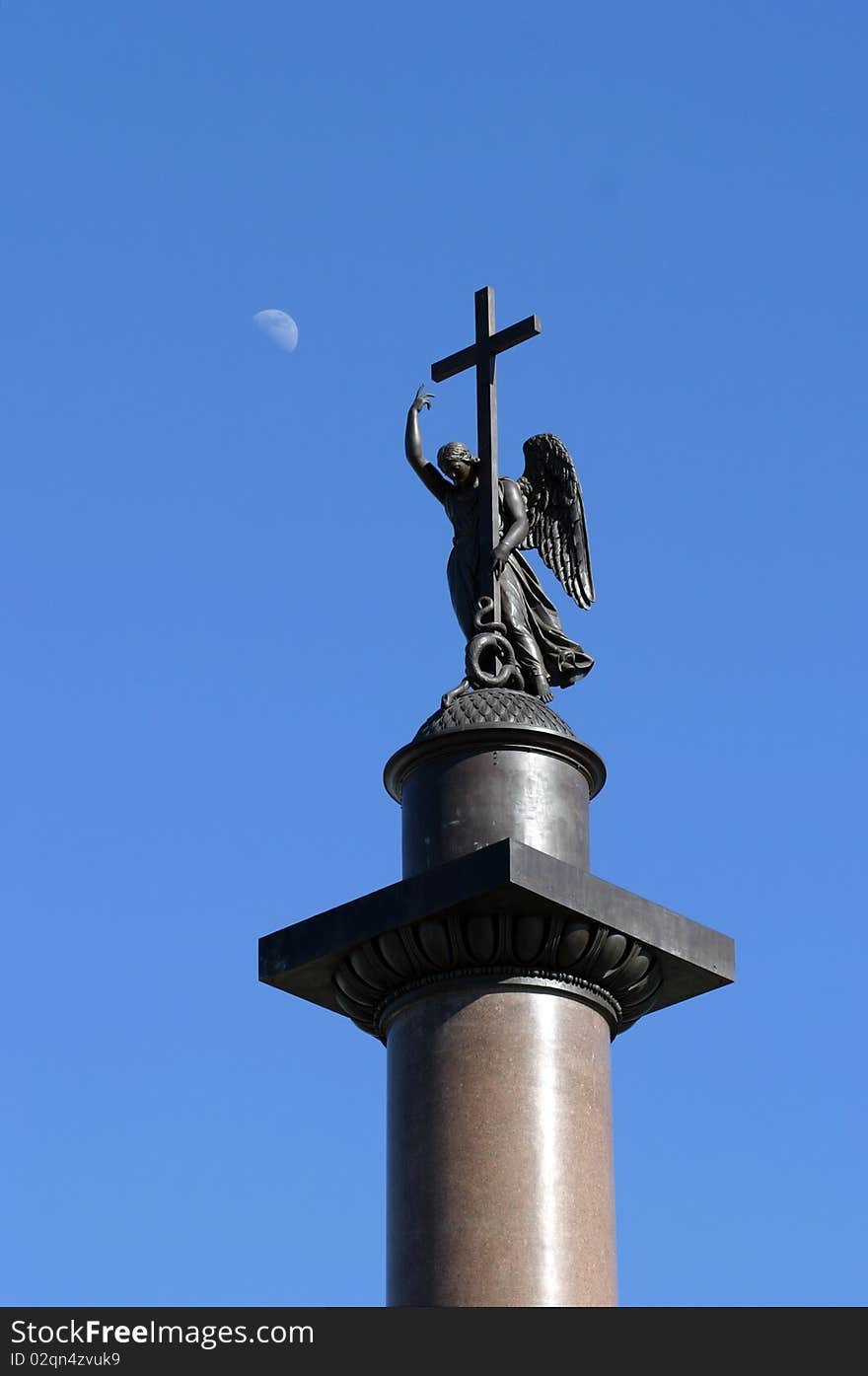 Figure of Аngel holding a cross on the top of Alexander Column on Winter Palace square in Saint-Petersburg, Russia. Figure of Аngel holding a cross on the top of Alexander Column on Winter Palace square in Saint-Petersburg, Russia