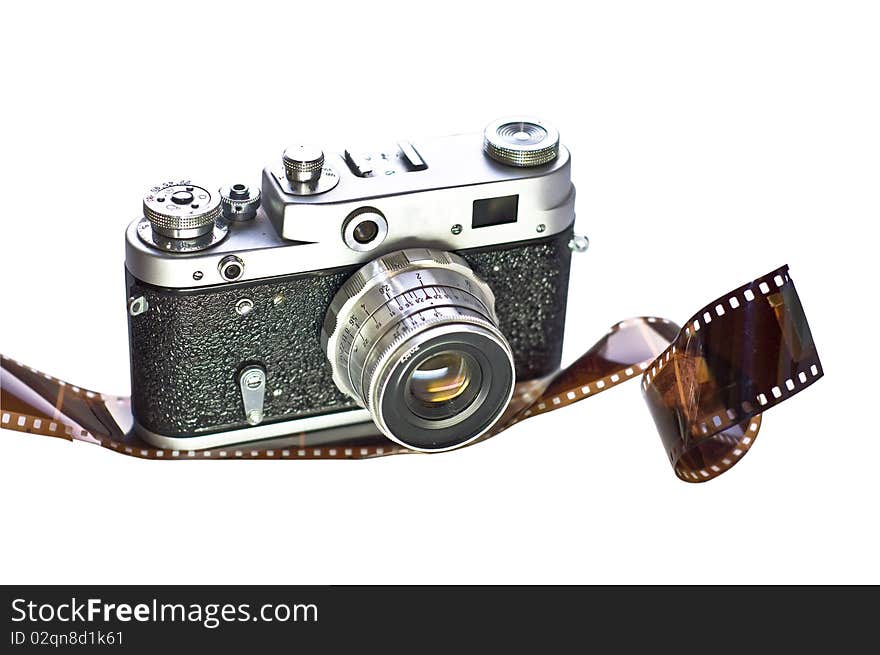 Retro film camera is shown on 35mm film. White background, isolation. Medium-format camera with interchangeable lenses.