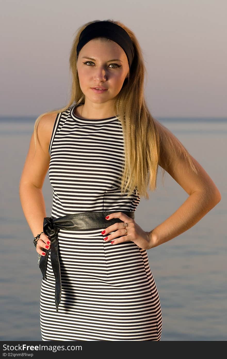 Pretty young girl posing at sea