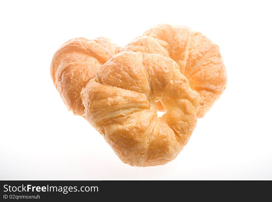 Three croissants on a white background. Three croissants on a white background