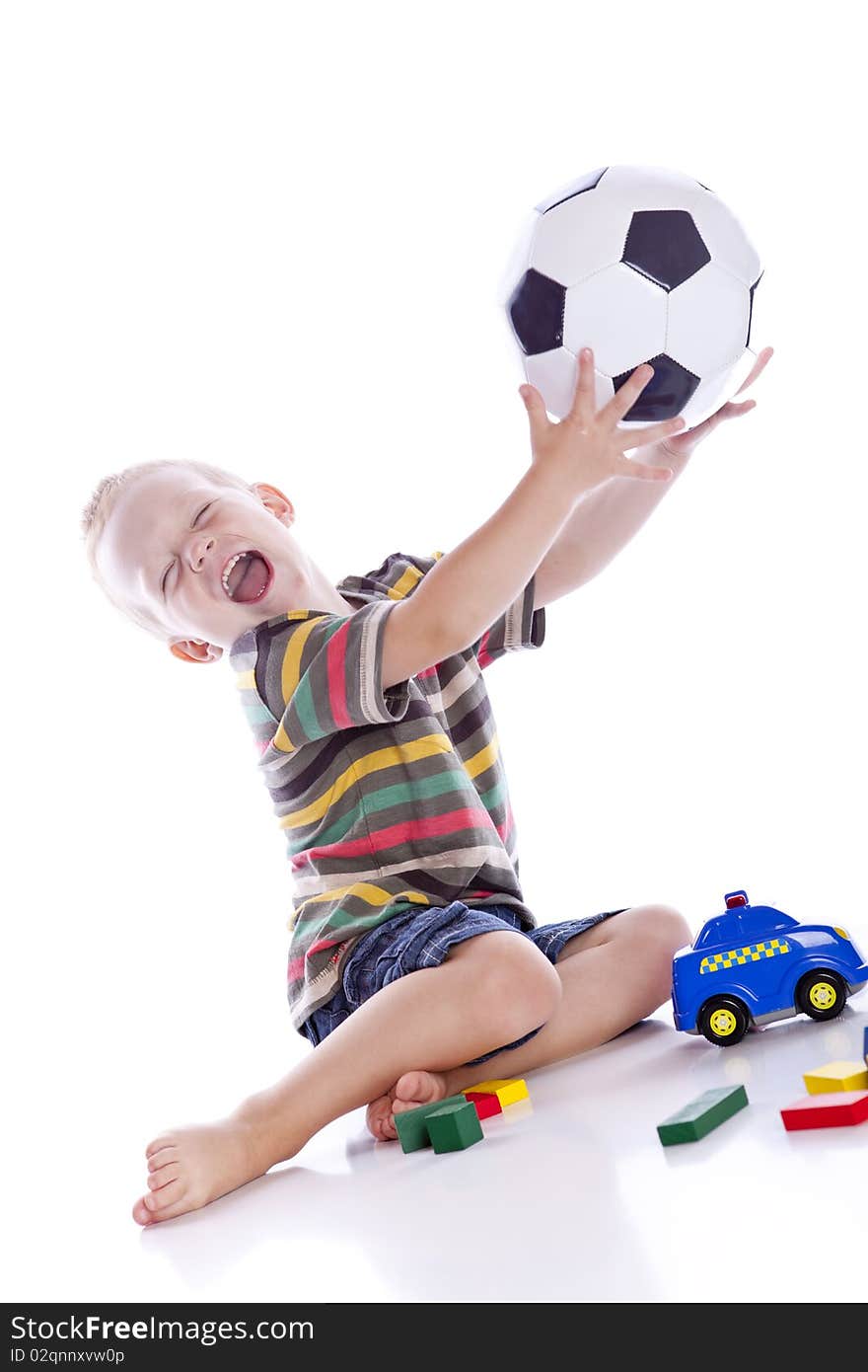 Adorable boy with ball a over white background