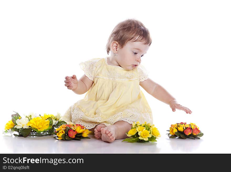 Portrait Of Lovely Baby Playing With Flower