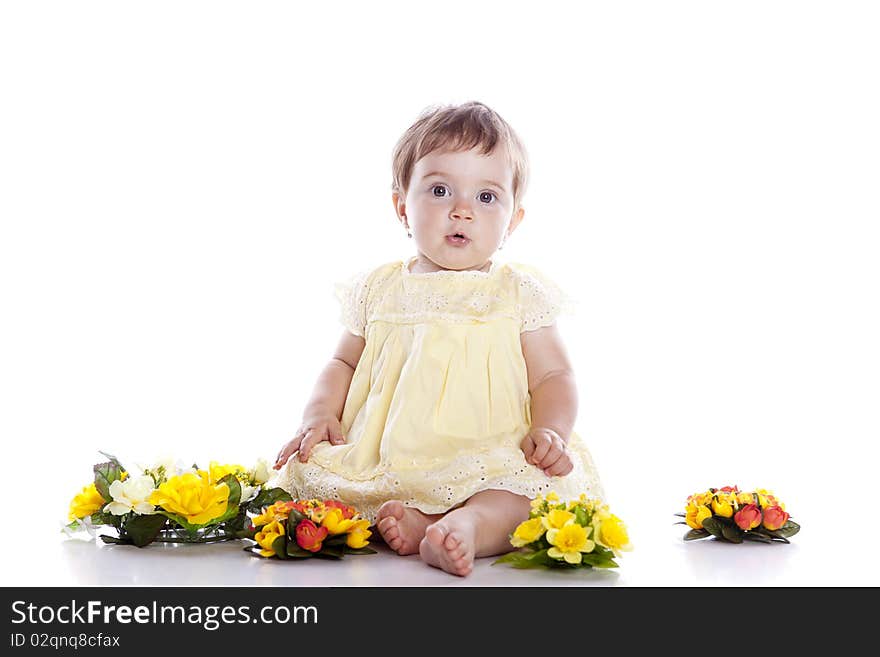 Portrait of lovely baby playing with flower