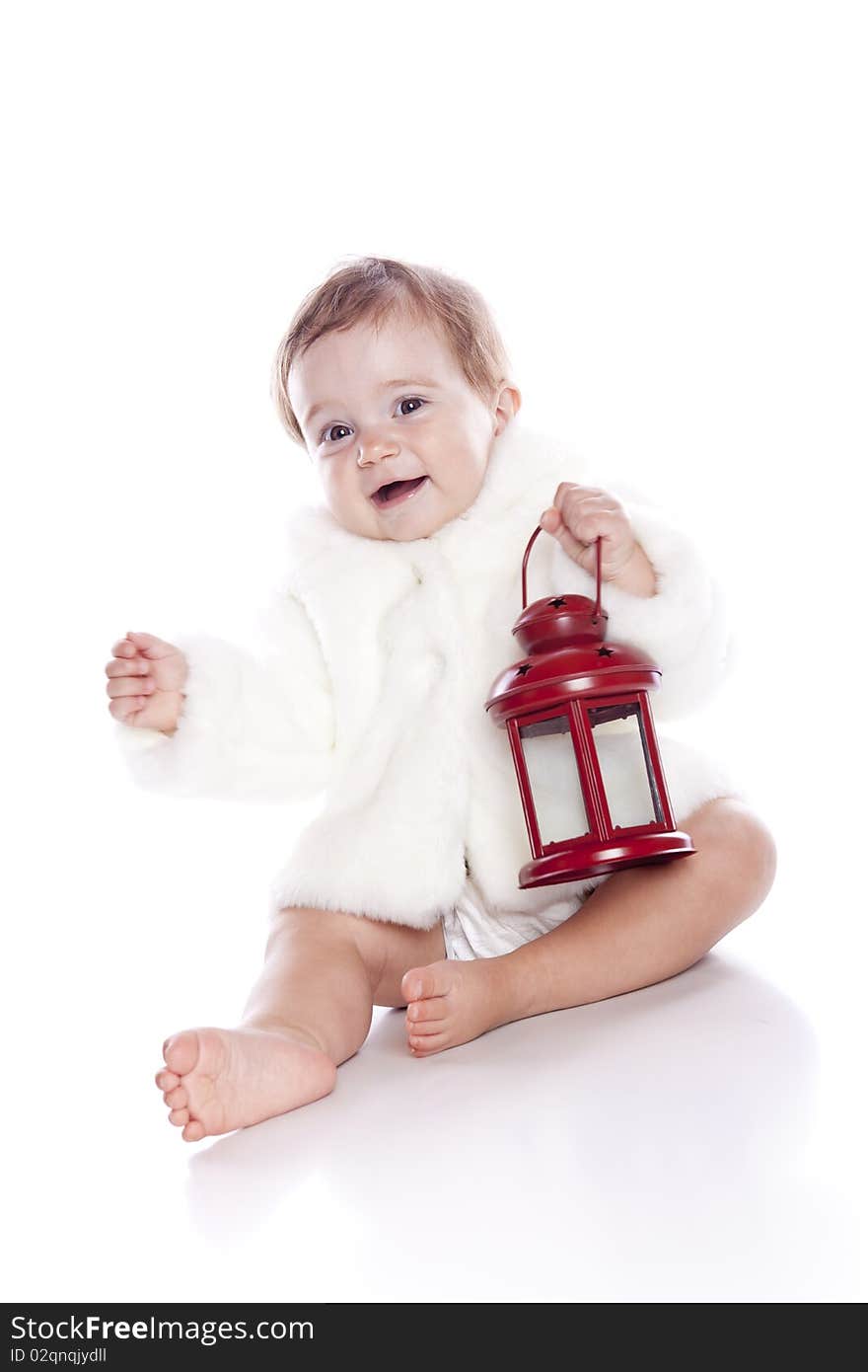 Cute little girl with a warm coat on white background