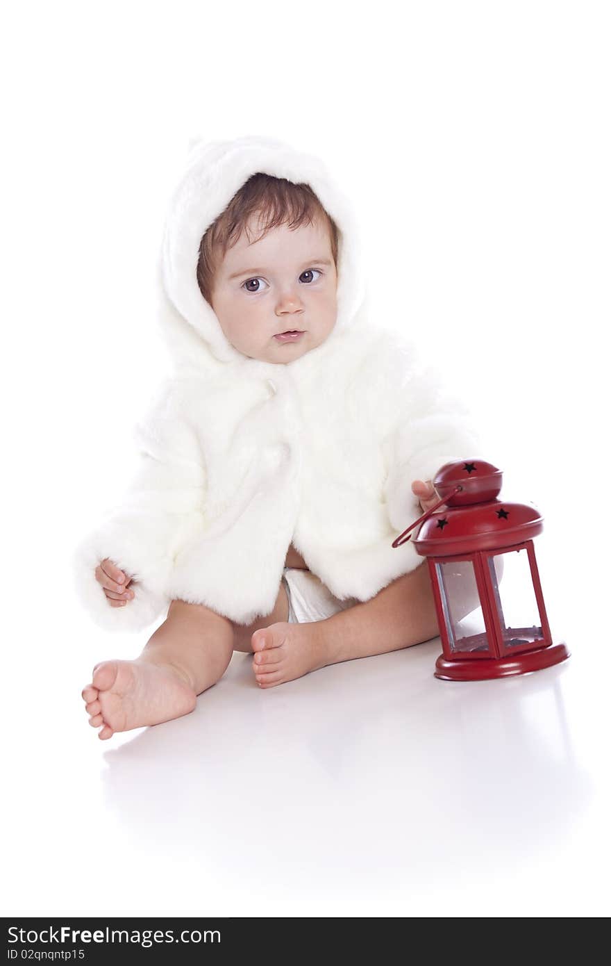 Cute little girl with a warm coat on white background