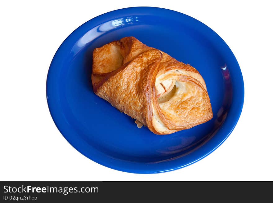 Croissant with apples on blue plate