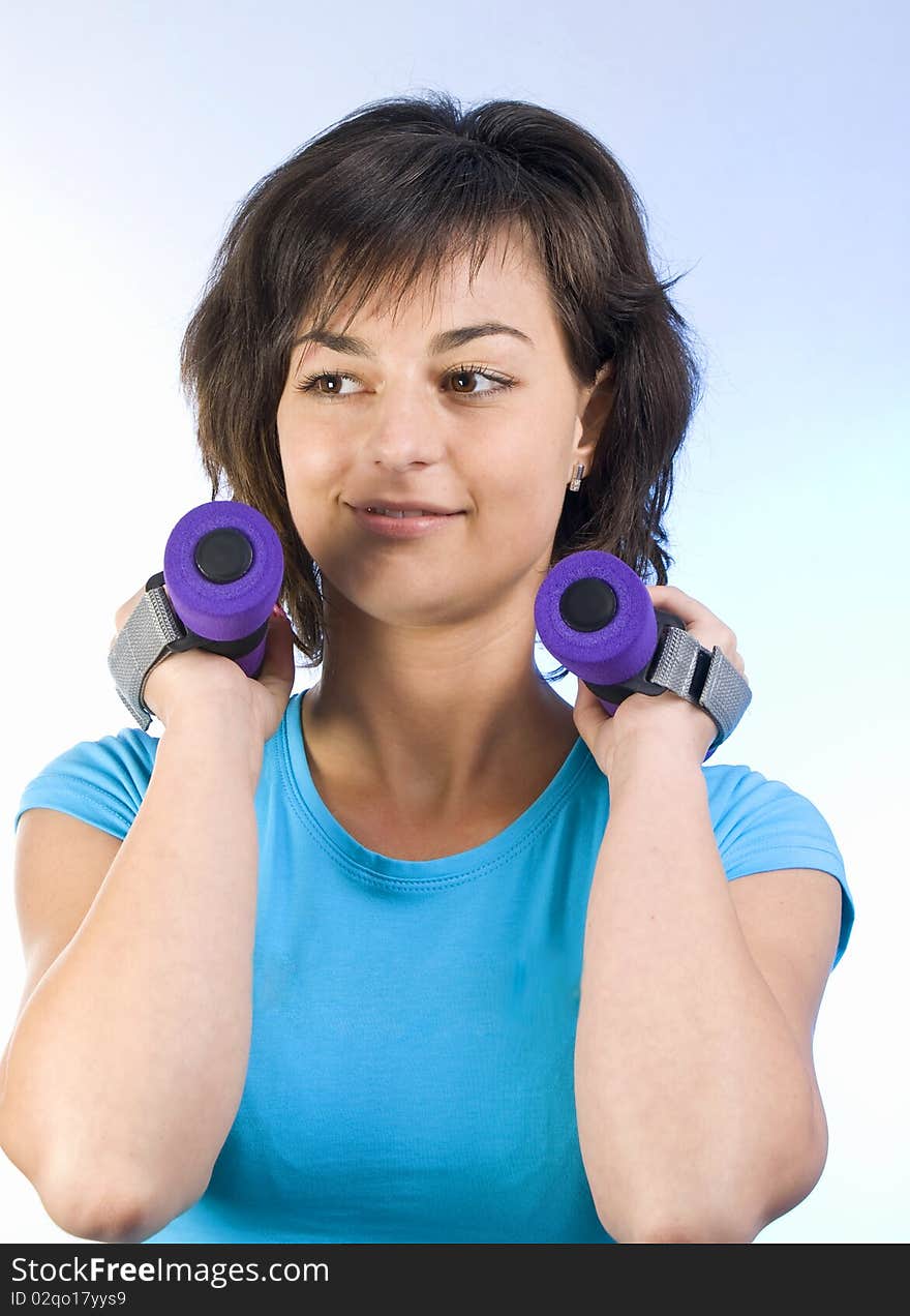 Young beautiful woman working out. Young beautiful woman working out