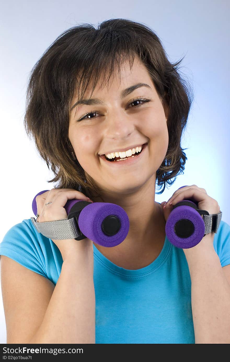 Young beautiful woman working out. Young beautiful woman working out