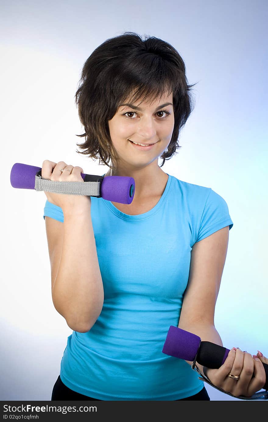 Young beautiful woman working out. Young beautiful woman working out