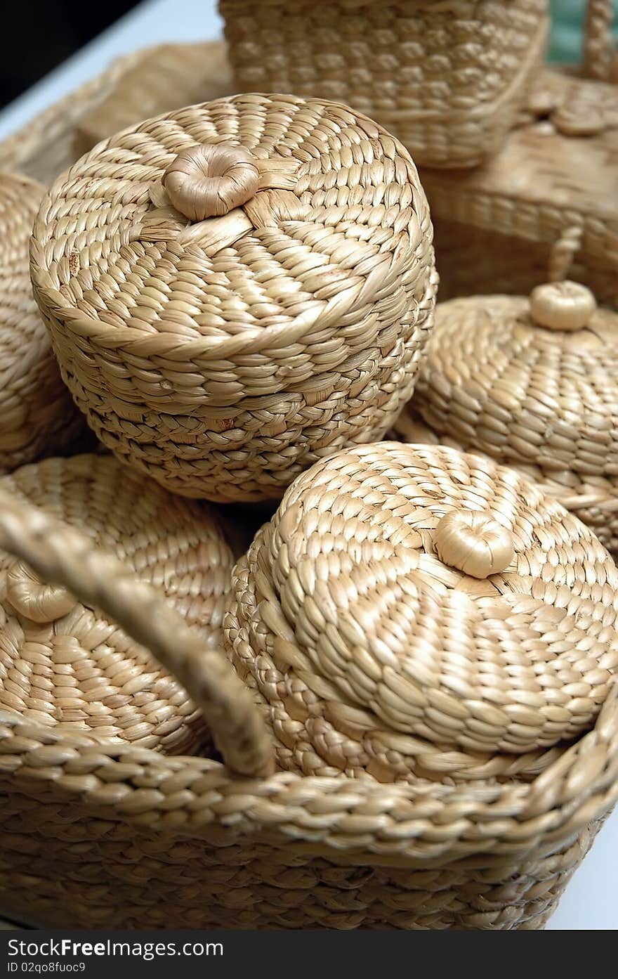 A brown wicker picnic basket