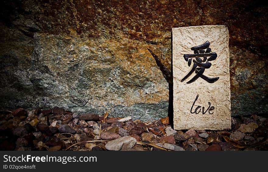 The word love written on a piece of rock. The word love written on a piece of rock