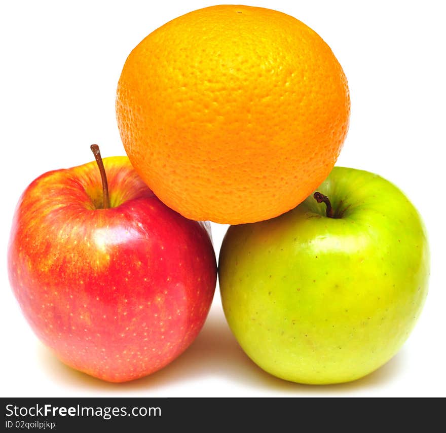 Stack of apple and orange on white background