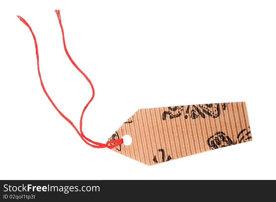 Tag is made of corrugated cardboard isolated on a white background. Tag is made of corrugated cardboard isolated on a white background