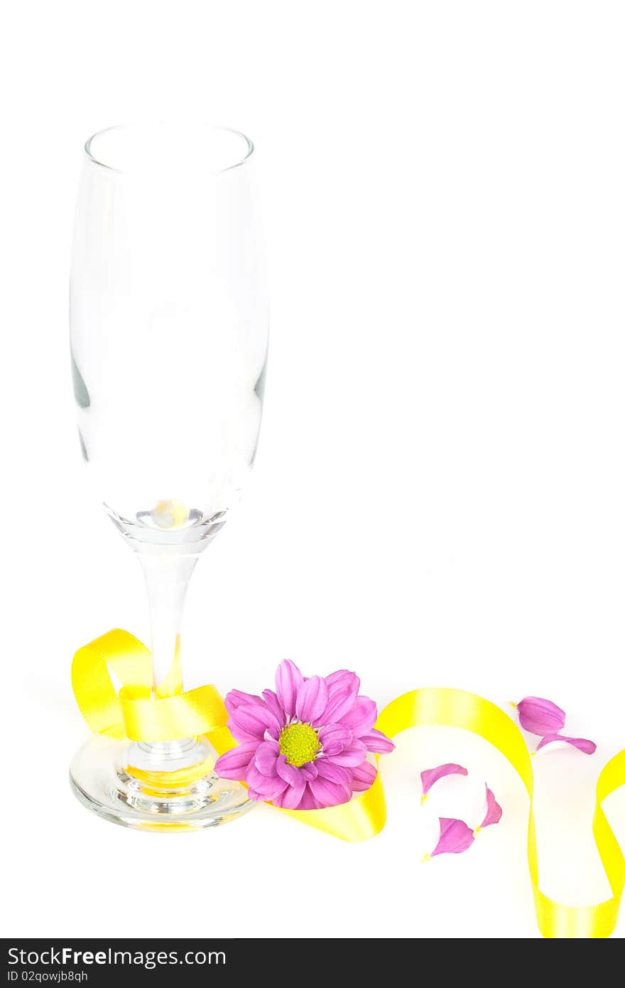 A champagne glass decorated and isolated on a white table