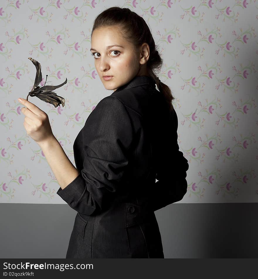 Portrait of a girl with a black lily. Portrait of a girl with a black lily