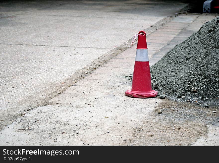 red sagety cones on a building road. red sagety cones on a building road