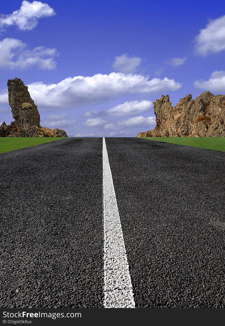 Perfect road with rocky background