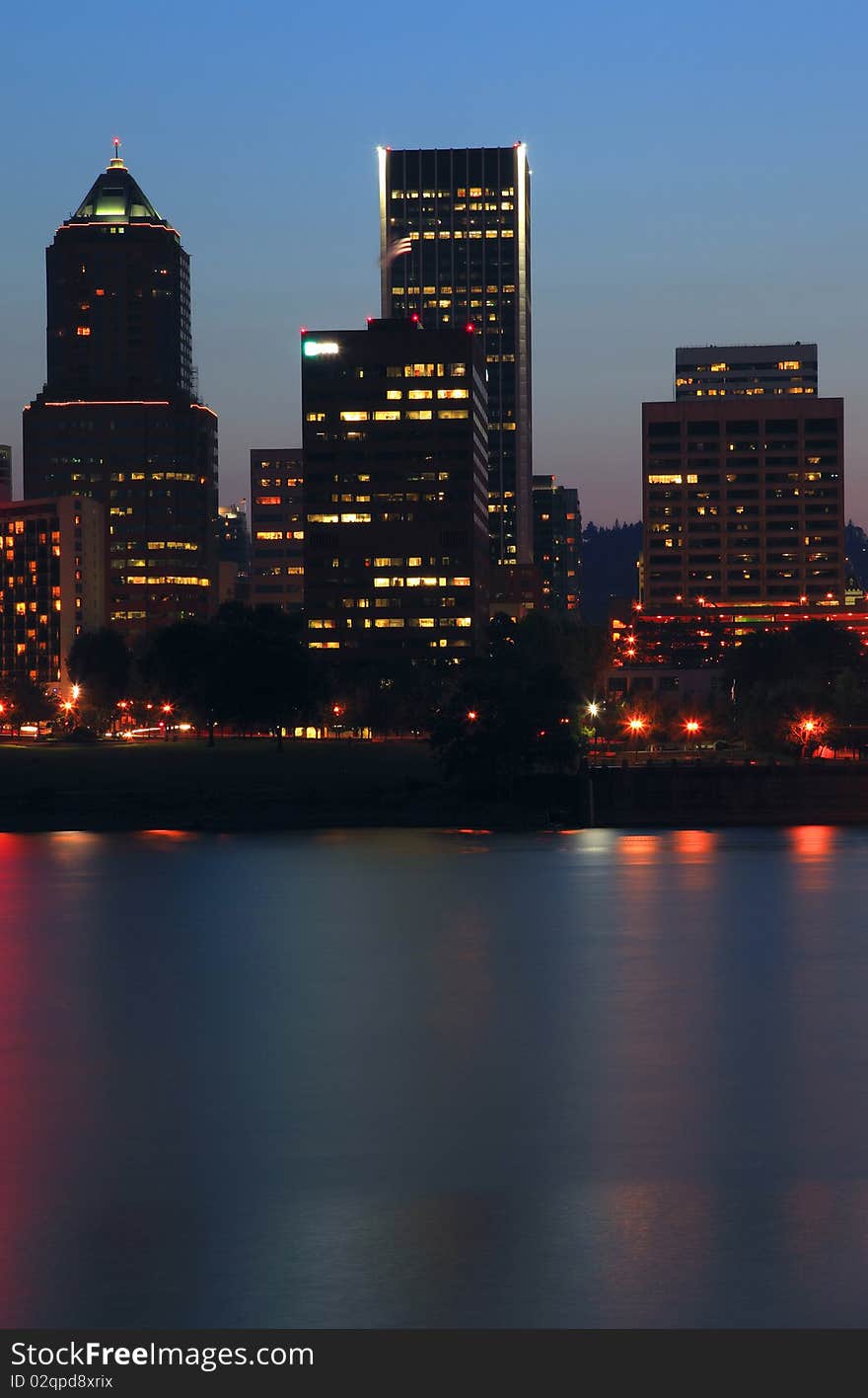 The glitter of lights on the modern buildings at dusk in Portland Oregon. The glitter of lights on the modern buildings at dusk in Portland Oregon.