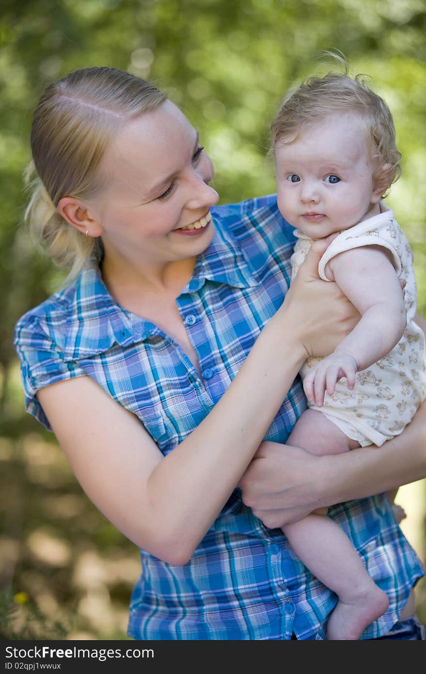 Portrait of happy mother and her child outdoor. Portrait of happy mother and her child outdoor