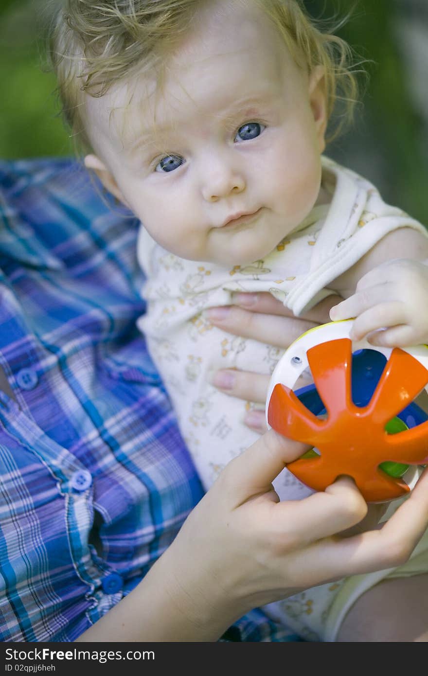 Mother with happy baby on the hands - outdoors. Mother with happy baby on the hands - outdoors