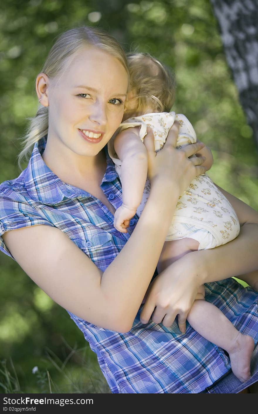 Portrait of happy mother with her baby on the hands. Portrait of happy mother with her baby on the hands