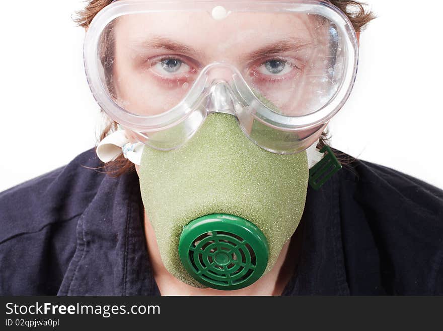 Man closeup in a respirator and safety glasses. Man closeup in a respirator and safety glasses