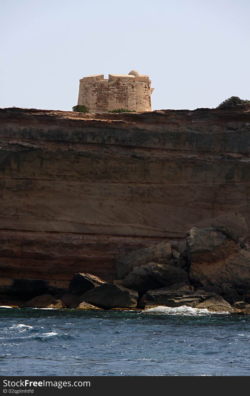 Stony medieval watch tower on the cliff