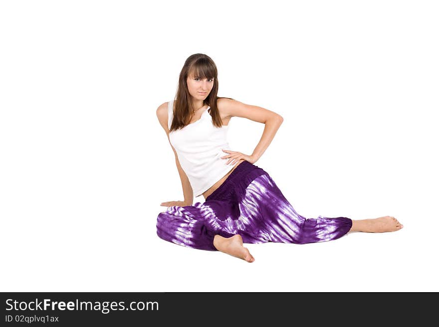 Sportive girl in ethnic clothes studio shot