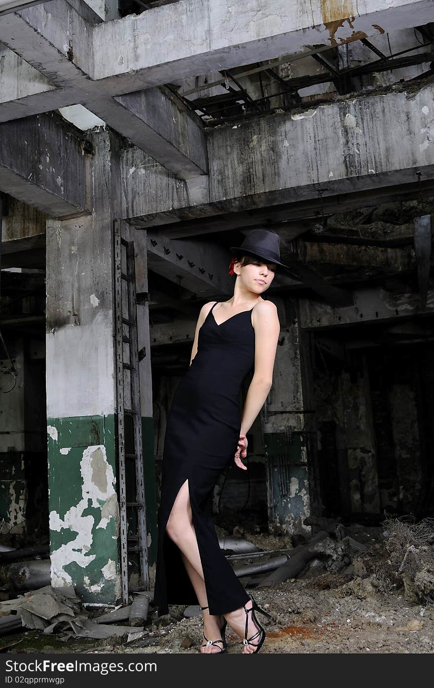 White young artist woman performing in devastated building. White young artist woman performing in devastated building