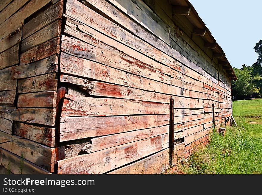 An old barn in a pasture, close up. An old barn in a pasture, close up.