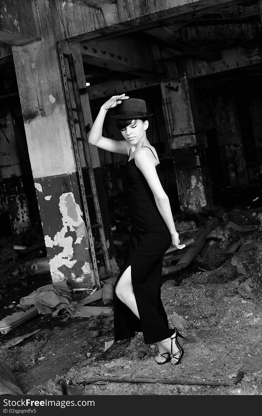 Elegant girl dancing in demolished construction