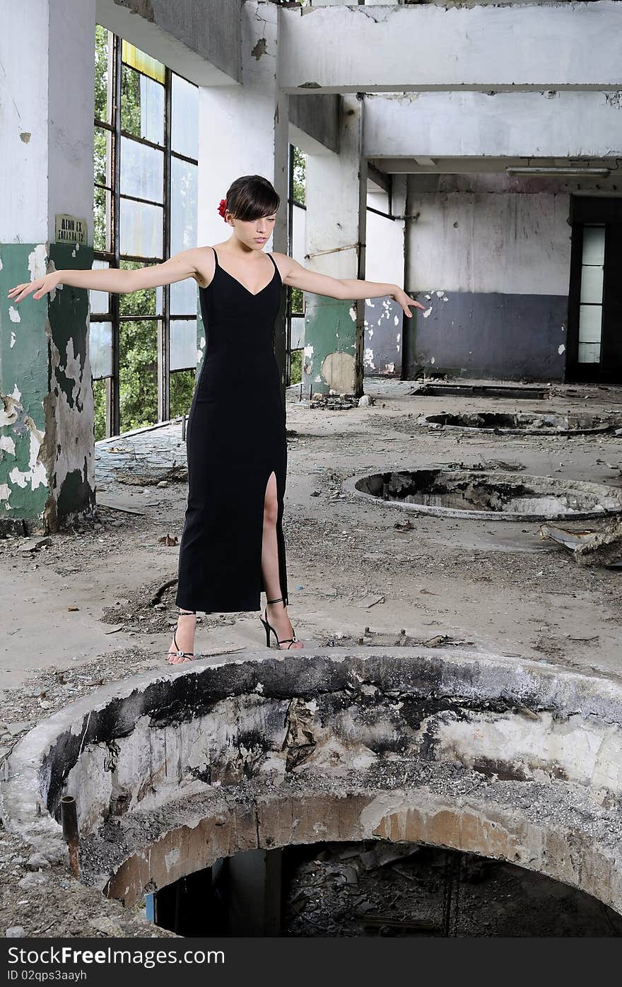 upset teenager girl trying to jump in demolished construction. upset teenager girl trying to jump in demolished construction