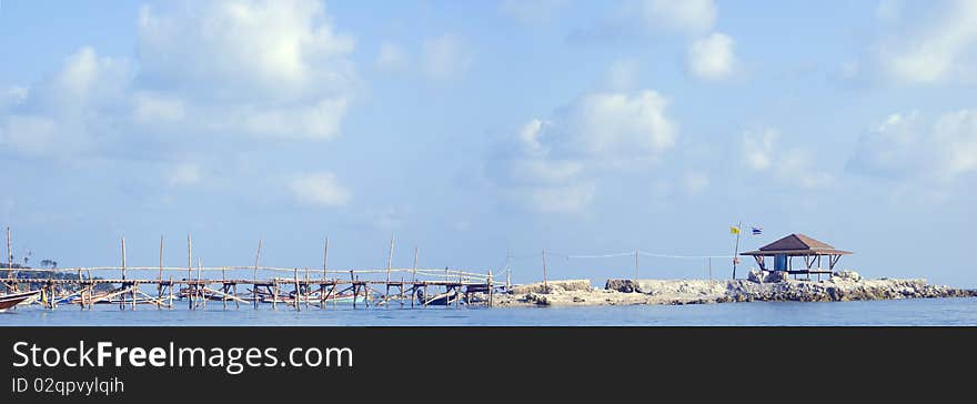 Quiet harbor under blue sky