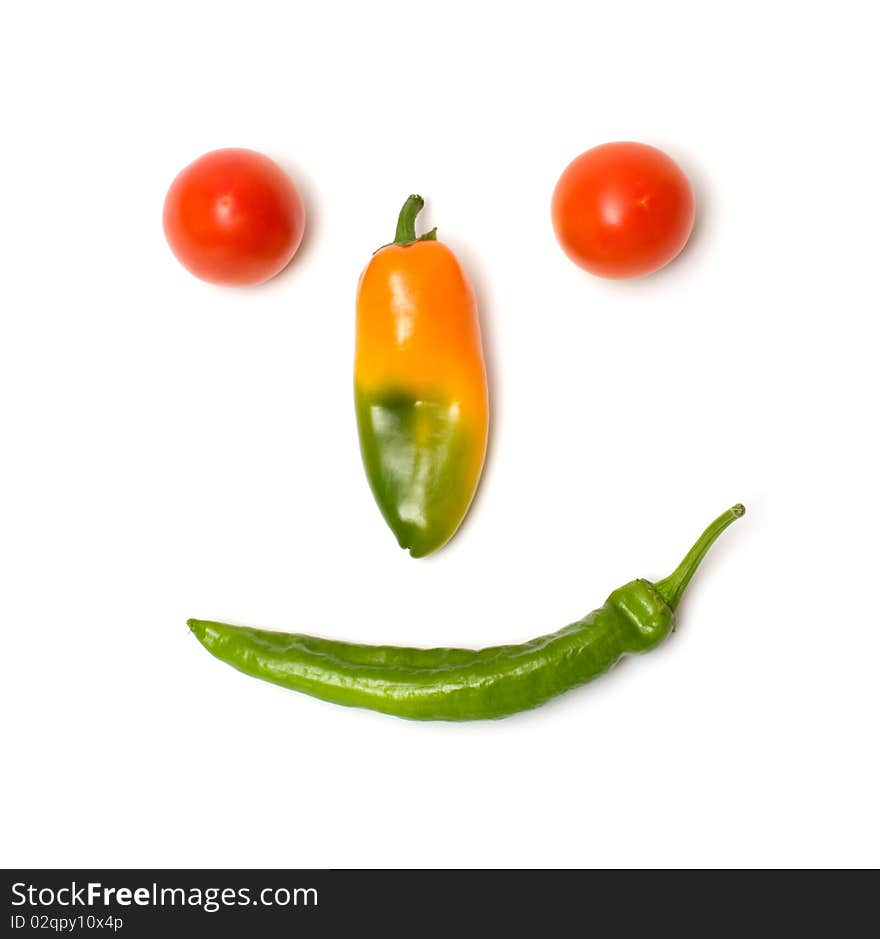 Smiling face of fresh vegetables isolated on a white background. Smiling face of fresh vegetables isolated on a white background.