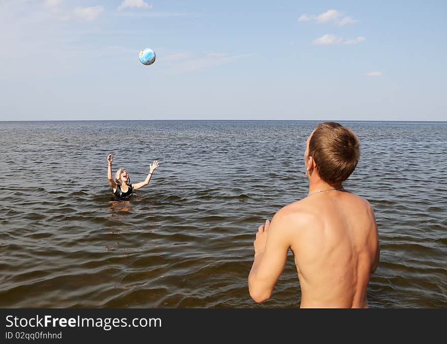 Girl and boy playing in the water. Girl and boy playing in the water.