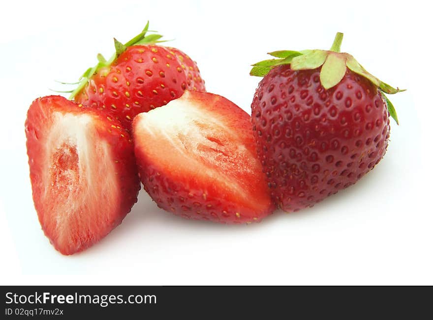 Ripe strawberry lobes on a white background