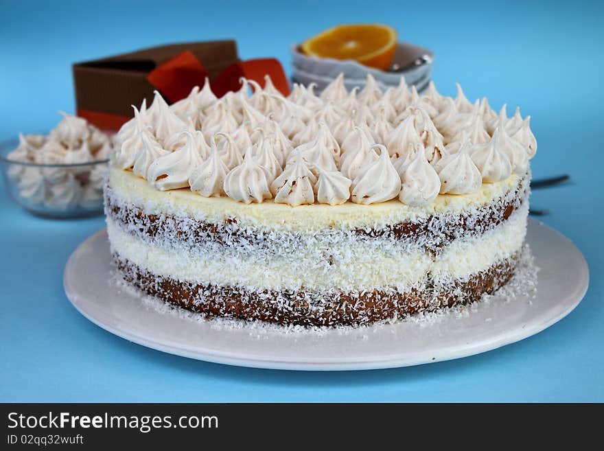 Delicious oranges mousse tart isolated on blue background