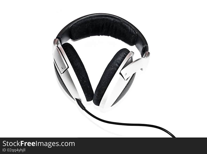 Silver headphones with black wire isolated on white background